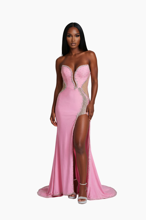 Woman wearing a pink evening gown with a high slit on a white background