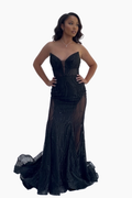 Woman wearing a black evening gown on a white background