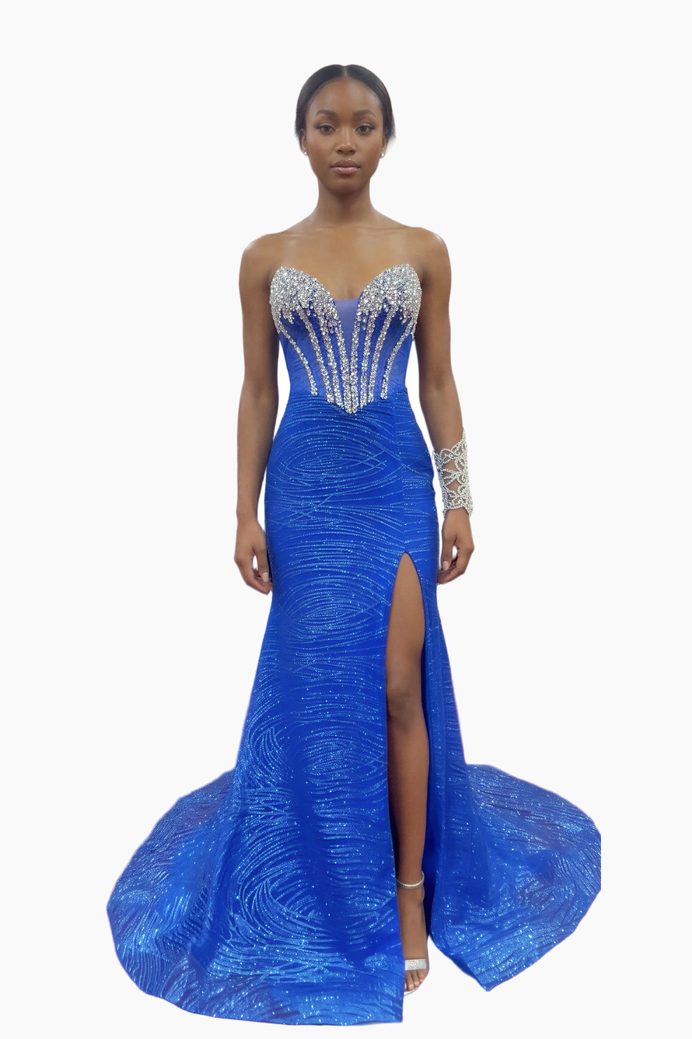 Woman wearing a blue evening gown with a high slit on a white background
