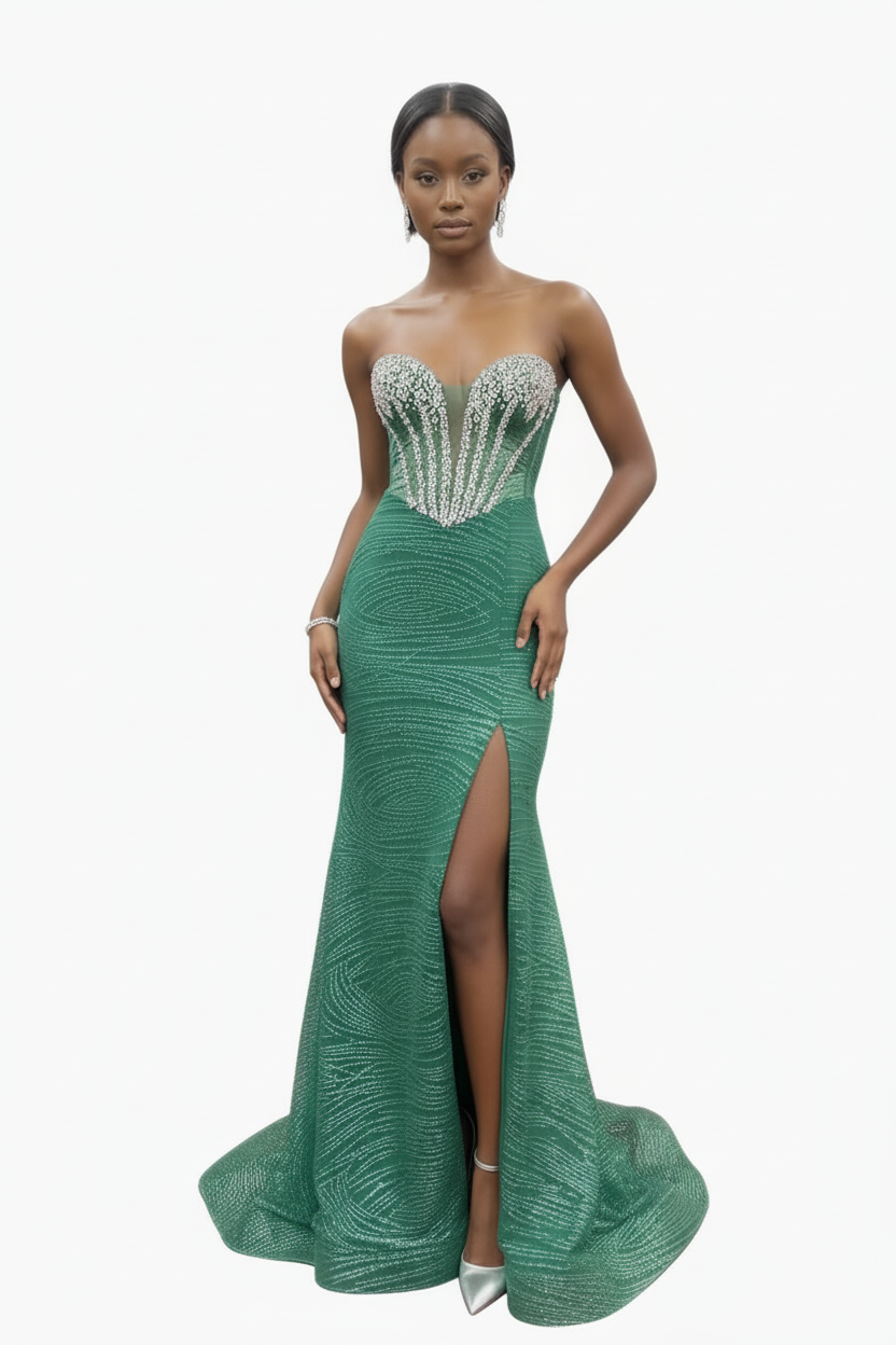 Woman wearing a green evening gown with a high slit on a white background
