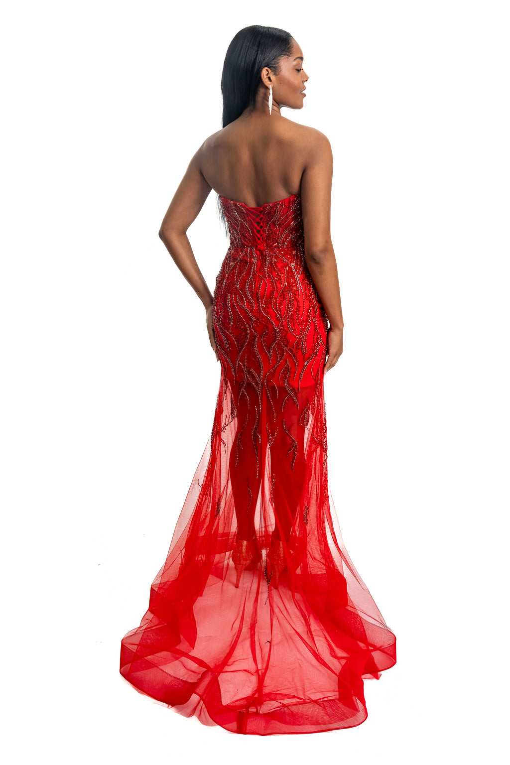 Red evening gown with intricate detailing on a white background