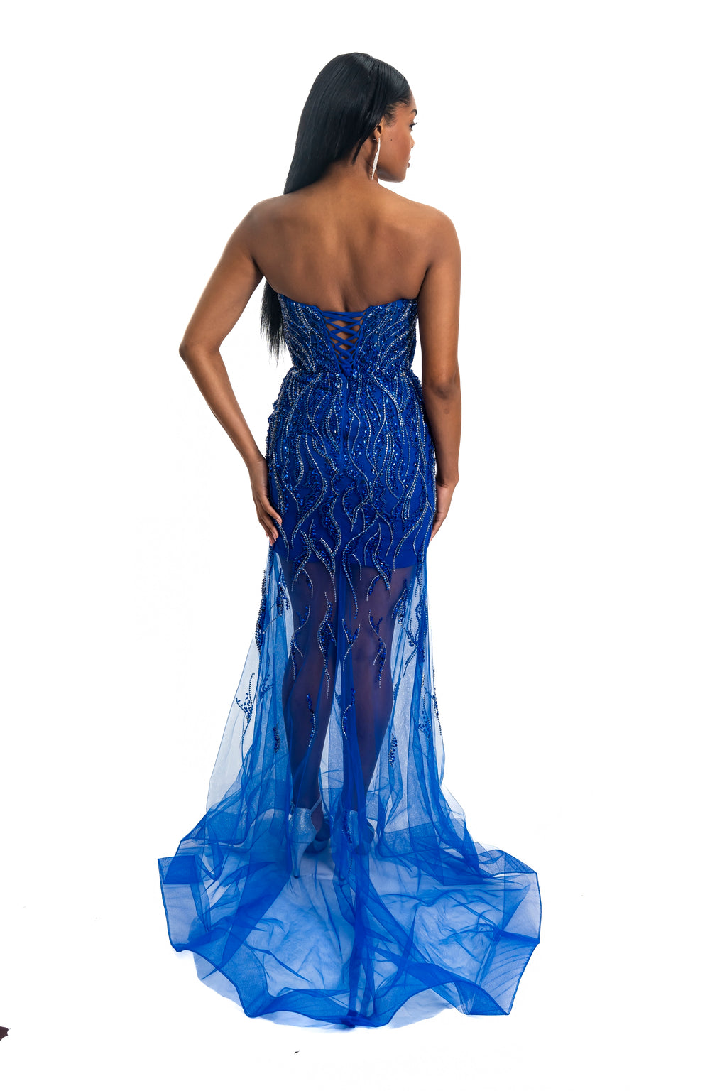 Blue strapless evening gown with intricate lace detailing on a white background
